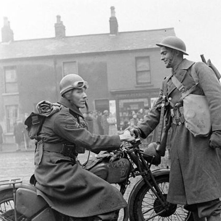 A member of the British Forces welcomes U.S. Army troops in Belfast on 26th January 1942