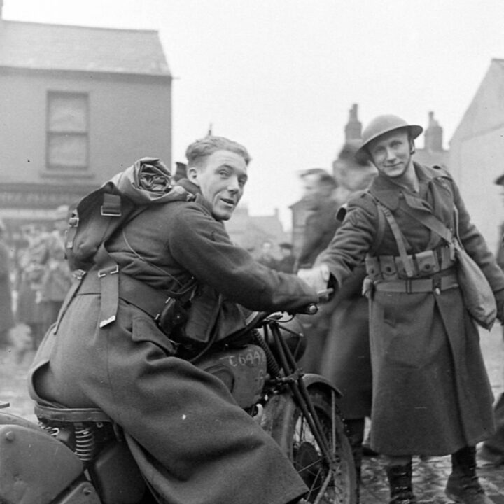 A member of the British Forces welcomes U.S. Army troops in Belfast on 26th January 1942