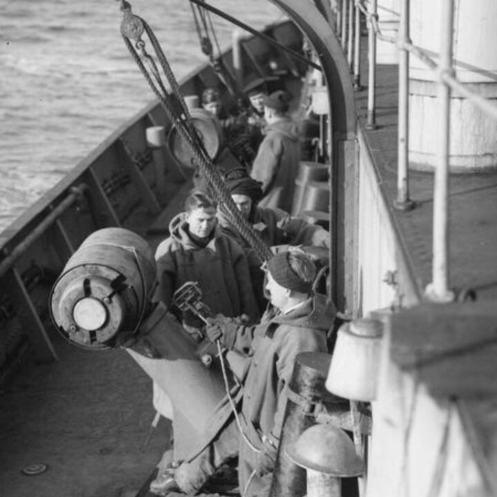 Crew members on board a vessel on convoy patrol prepare to launch depth charges in the North Atlantic on 22nd February 1941