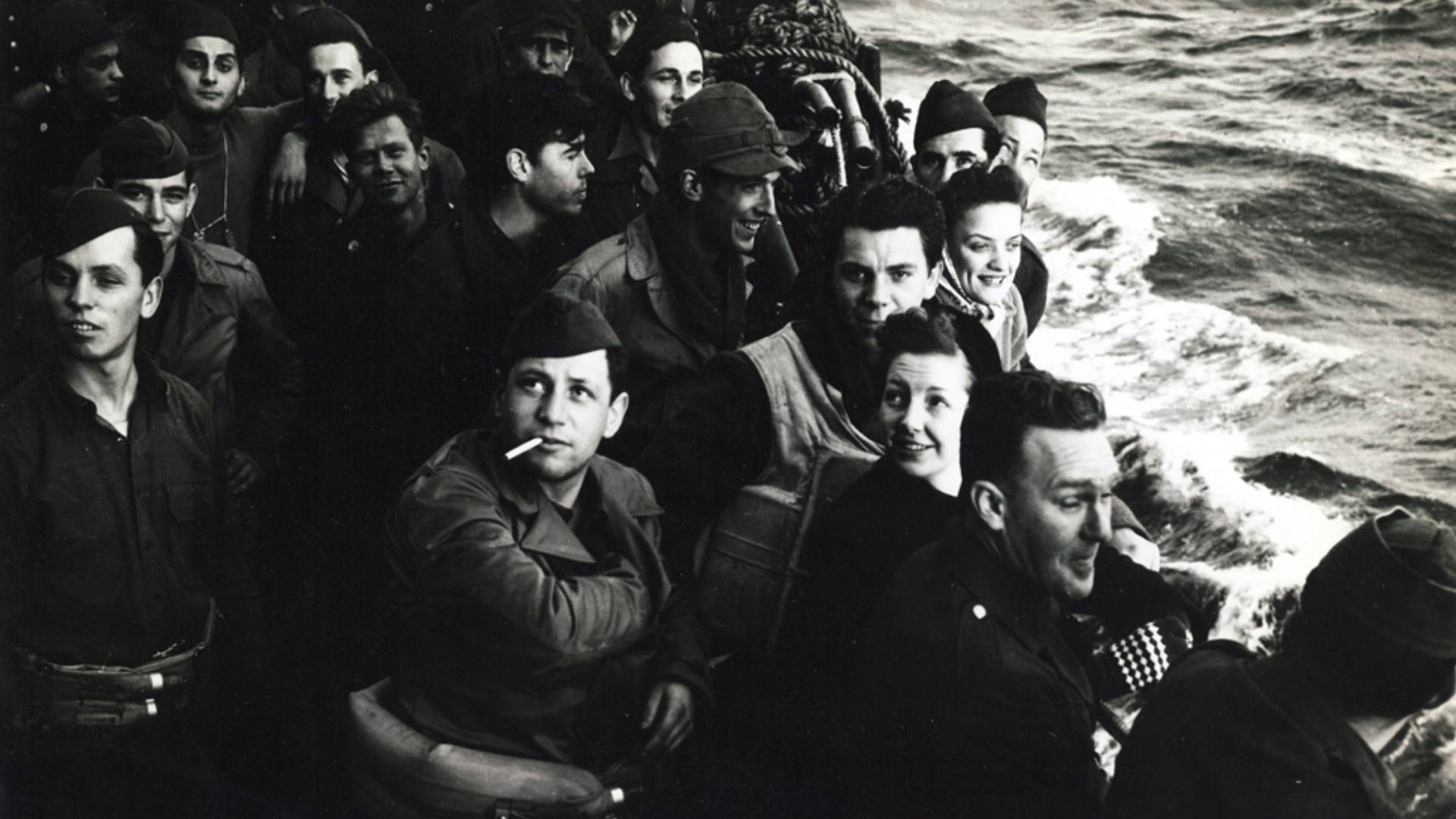 U.S. Soldiers relax on deck on an Atlantic crossing to Northern Ireland in February 1942