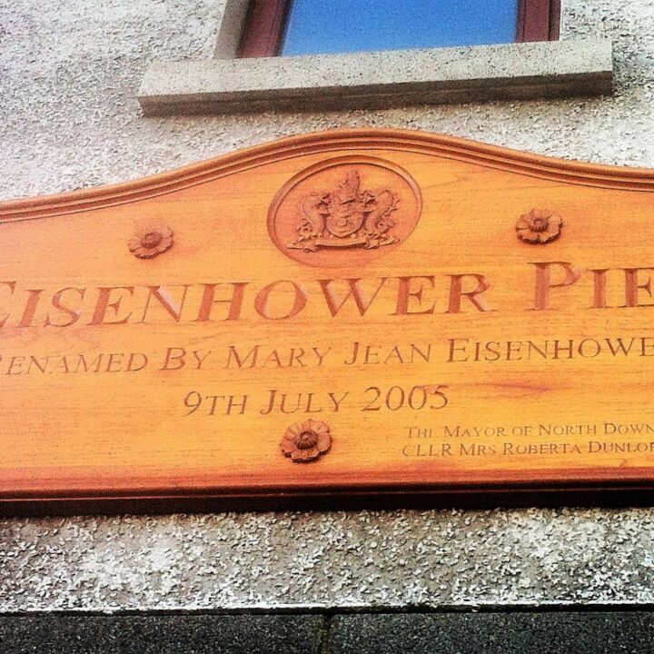 A commemorative plaque on the north pier in Bangor, Co. Down depicts the events of D-Day, 6th June 1944. Since 2005, the pier has borne the name of General Eisenhower who addressed troops here in advance of the Normandy invasion.
