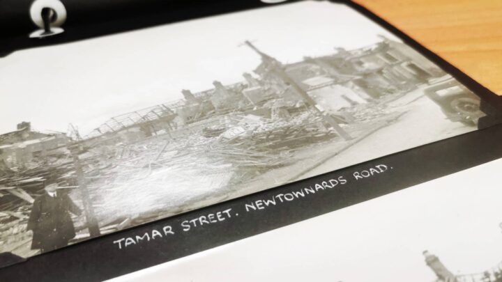Photographs of the destruction caused by Luftwaffe raids on Belfast in April and May 1941 contained within a small leather-bound album in the custody of The Linen Hall, Belfast.