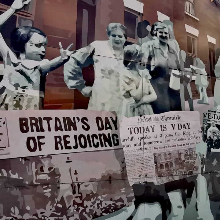 A mural depicting the jubilant scenes within the communities of northwest Belfast on Victory in Europe or V.E Day, 8th May 1945 on Dover Place, Belfast.