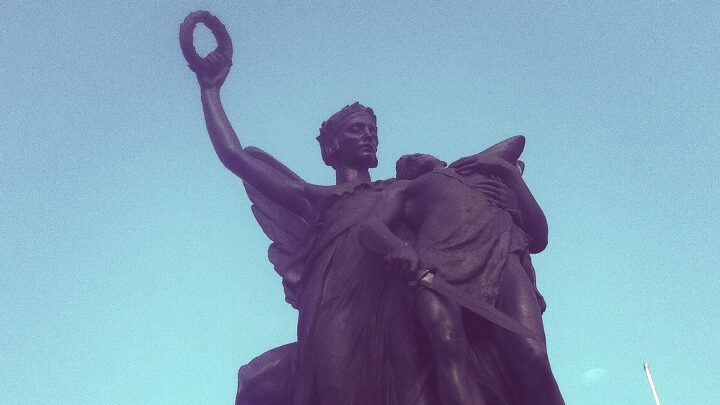 The statue standing atop the Queen's University War Memorial on University Road, Belfast.