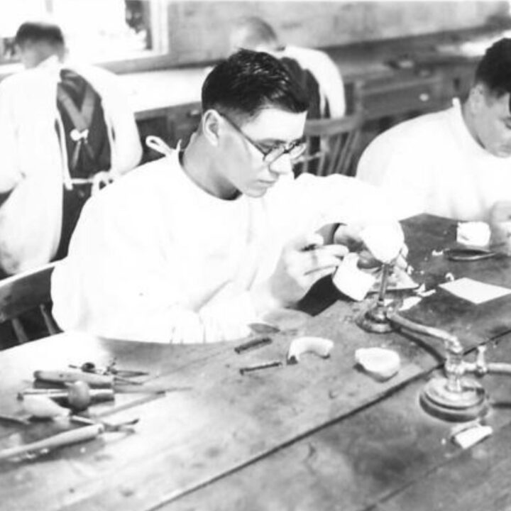 A Dental Mechanic using specialist tools to build dentures at the Army Dental Laboratory, Palace Barracks, Holywood, Co. Down.