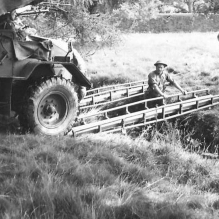 A Portee Truck carrying an anti-tank gun prepares to cross a section of bridge consisting of a pair of tubular girders during a training exercise in Northern Ireland.