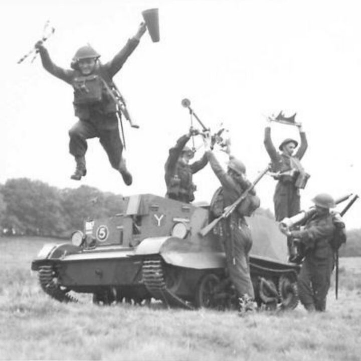 Members of 1st Battalion, Princess Alexandra of Wales’ Own Yorkshire Regiment (The Green Howards) leap from a Universal Carrier carrying parts of a 3” mortar at Omagh, Co. Tyrone.