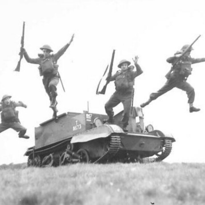 Members of 1st Battalion, Princess Alexandra of Wales’ Own Yorkshire Regiment (The Green Howards) leap from a Universal Carrier at Omagh, Co. Tyrone.