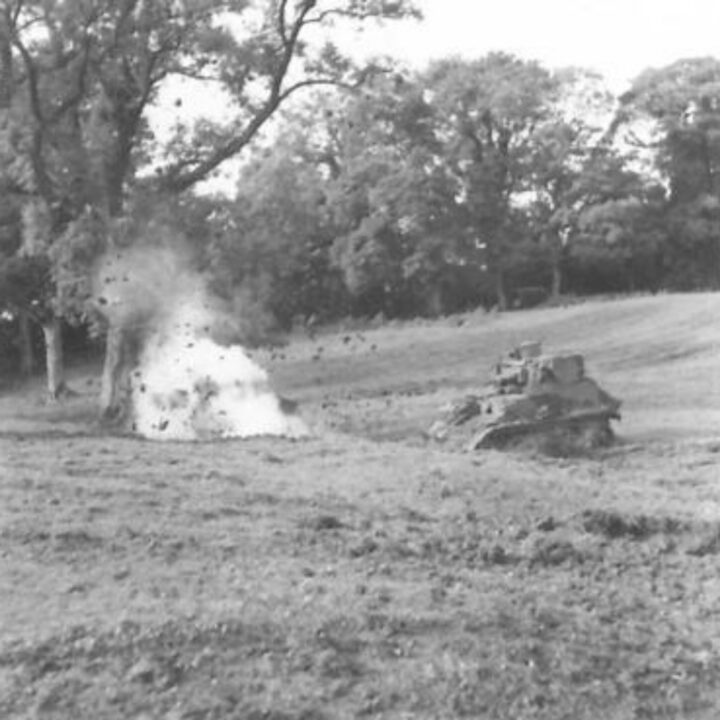 Members of the 6th Battalion, Royal Berkshire Regiment make use of a Light Tank to cross a minefield during realistic toughening up training in Coleraine, Co. Londonderry.
