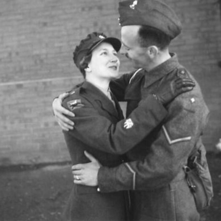 Staff Sergeant Mabel Kathleen Twist, thought to be the only person of her rank in Northern Ireland was commended by Auxiliary Territorial Service Chief Controller Jean Knox as the 'smartest woman in the A.T.S.'. She is embraced by her husband Lance Bombardier Twist, on leave from England.