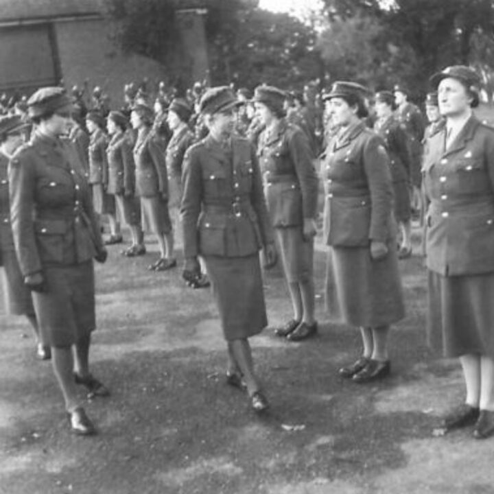 Staff Sergeant Mabel Kathleen Twist, thought to be the only person of her rank in Northern Ireland was commended by Auxiliary Territorial Service Chief Controller Jean Knox as the 'smartest woman in the A.T.S.'. A Group Commander inspects other members of the service at Northern Ireland District H.Q.