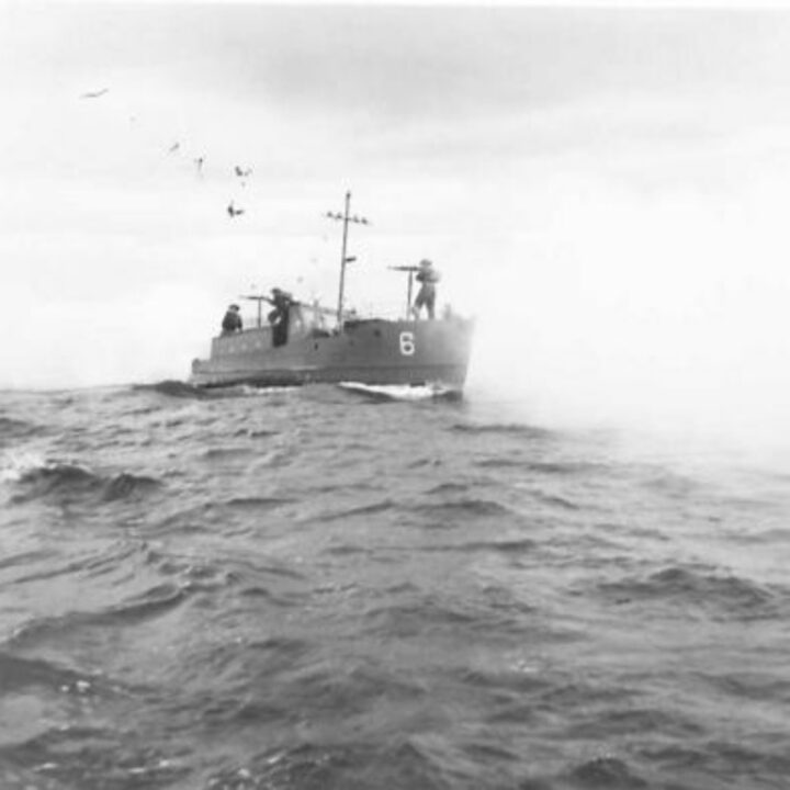 A vessel of the Inland Water Transport, Royal Engineers laying a smoke screen while on patrol in Lough Neagh, Northern Ireland.