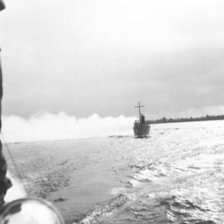 A vessel of the Inland Water Transport, Royal Engineers laying a smoke screen while on patrol in Lough Neagh, Northern Ireland.