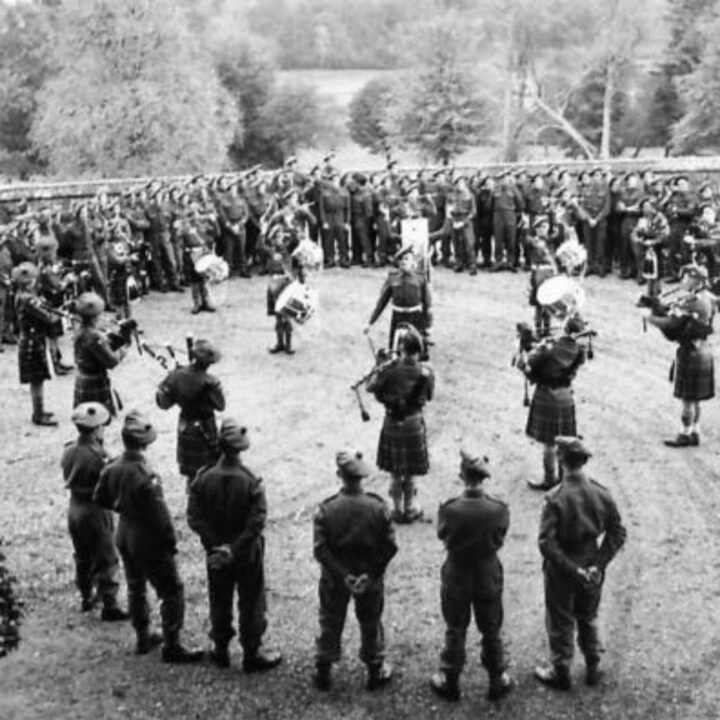 Pipes and drums of 6th Battalion, Seaforth Highlanders perform in front of an interested party of other members of the battalion at Crom Castle, Newtownbutler, Co. Fermanagh.