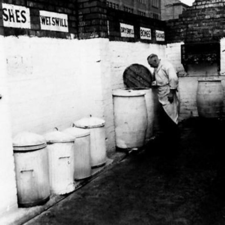 Sergeant inspecting swill tubs at the Royal Army Service Corps depot in Belfast.