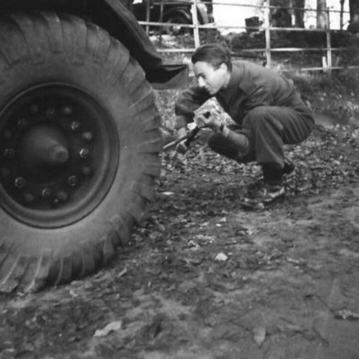 A soldier prepares to change a tyre by jacking up a lorry of an Ulster Home Guard Motor Transport Company in Northern Ireland. At the time, it was thought to be the only such company in the United Kingdom.