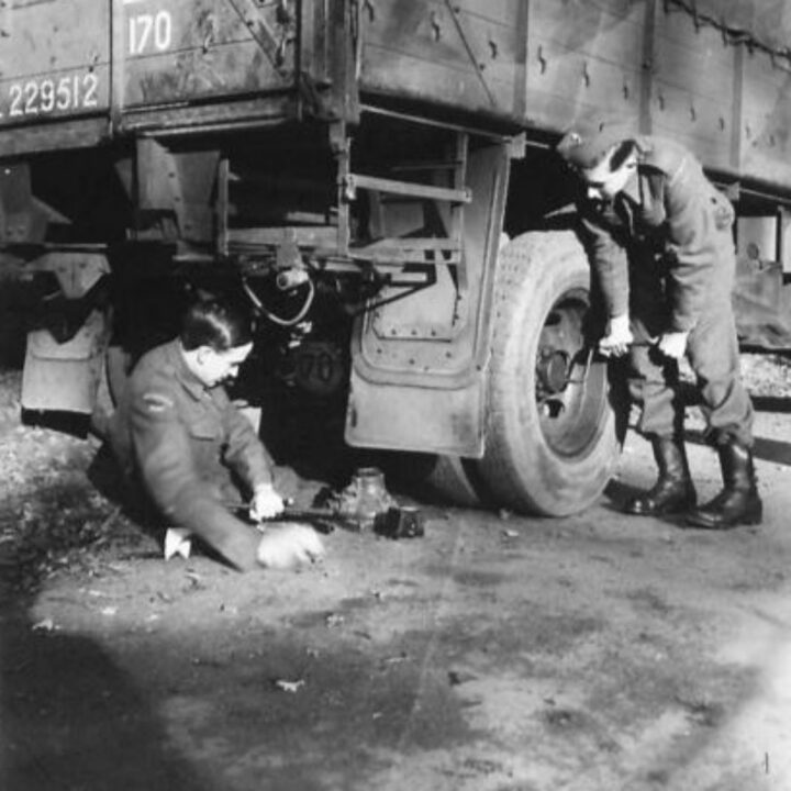 Two soldiers complete the task of changing a tyre on a lorry of an Ulster Home Guard Motor Transport Company in Northern Ireland. At the time, it was thought to be the only such company in the United Kingdom.