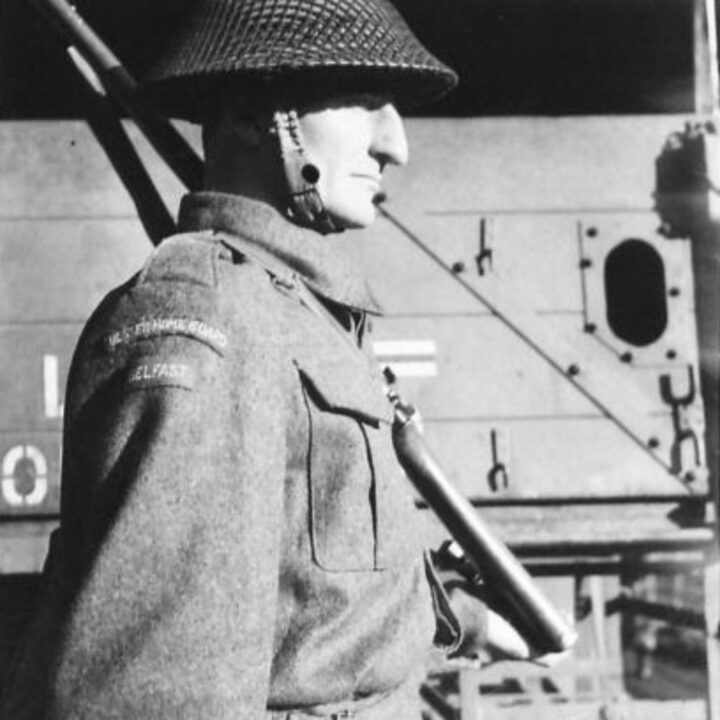 A soldier stands next to a lorry of an Ulster Home Guard Motor Transport Company in Northern Ireland. At the time, it was thought to be the only such company in the United Kingdom.