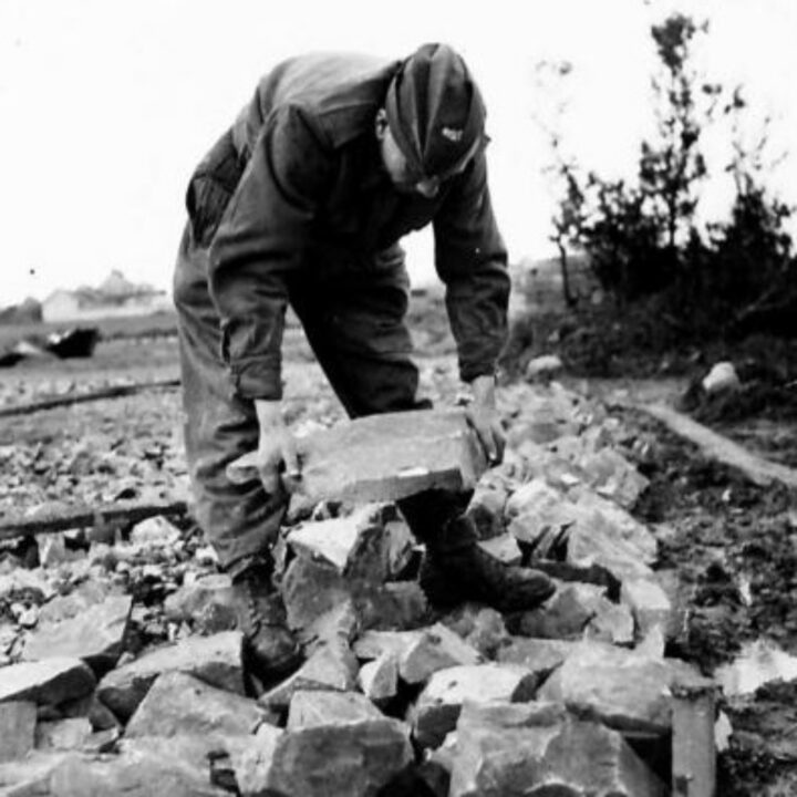 A member of The Pioneer Corps laying the foundations of a gun pit in Northern Ireland.