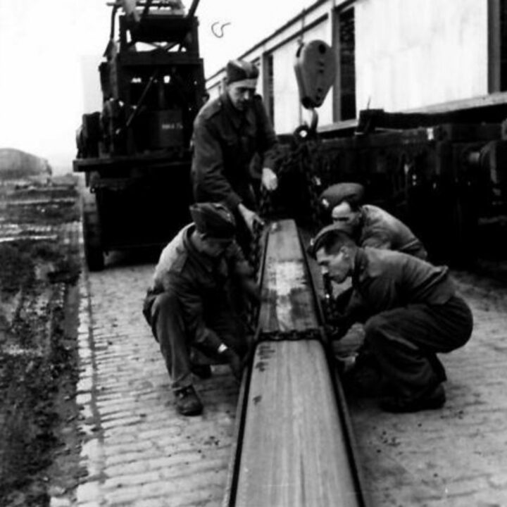 Members of The Pioneer Corps handling steel used for sheet piling in Northern Ireland.