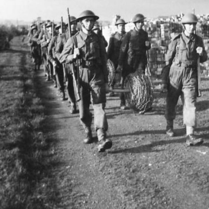 Members of The Pioneer Corps arrive equipped qith barbed wire for inspection in Northern Ireland.