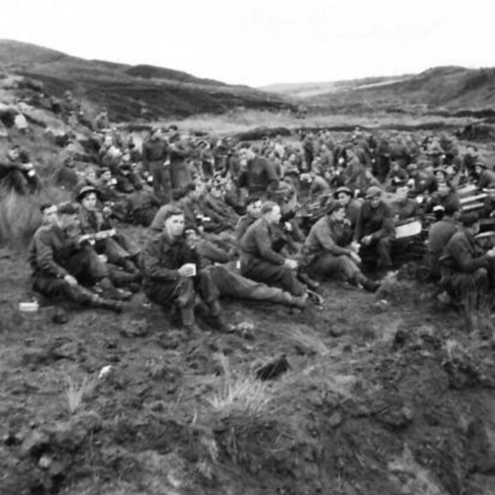 Members of 61st Divisional Engineers cutting a new road through the Sperrin Mountains at Templemoyle, south of Dungiven, Co. Londonderry. The soldiers break for a mid-day meal.