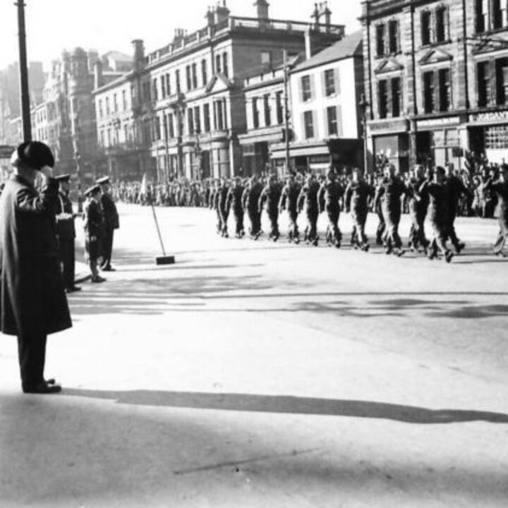 The Duke of Abercorn takes the salute as soldiers and members of the Auxiliary Territorial Service march past the saluting base for a Battle of Britain commemoration parade at City Hall, Belfast.