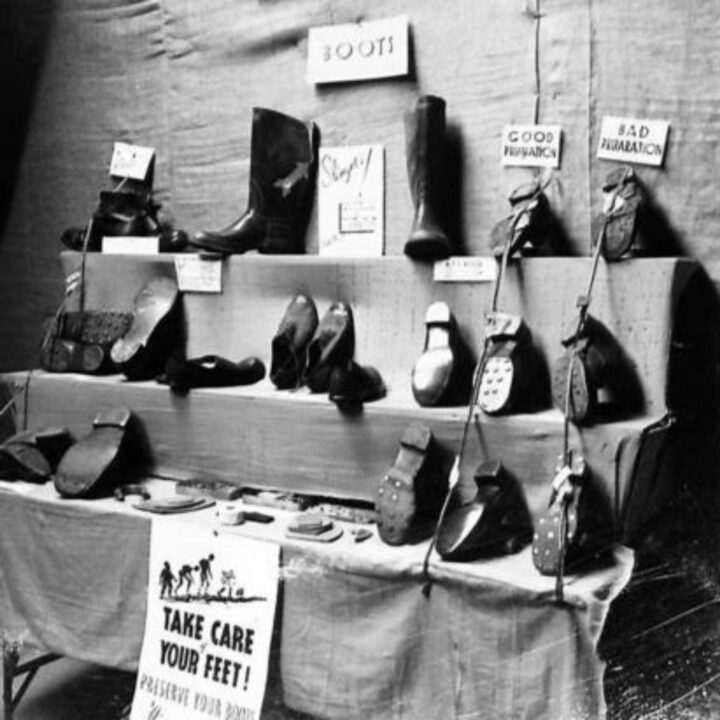 An exhibit stand on the care of feet and preserving of boots at an Army Salvage Exhibition in Northern Ireland photographed for O.S.12 War Office.