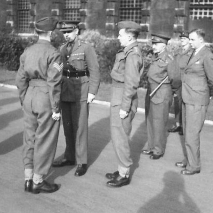 Major General Lord Bridgeman D.S.O., M.C. (Director General of the Home Guard) talking to a Sergeant during an inspection of a Cadet Battalion of the Royal Ulster Rifles at the Royal Belfast Academical Institution.