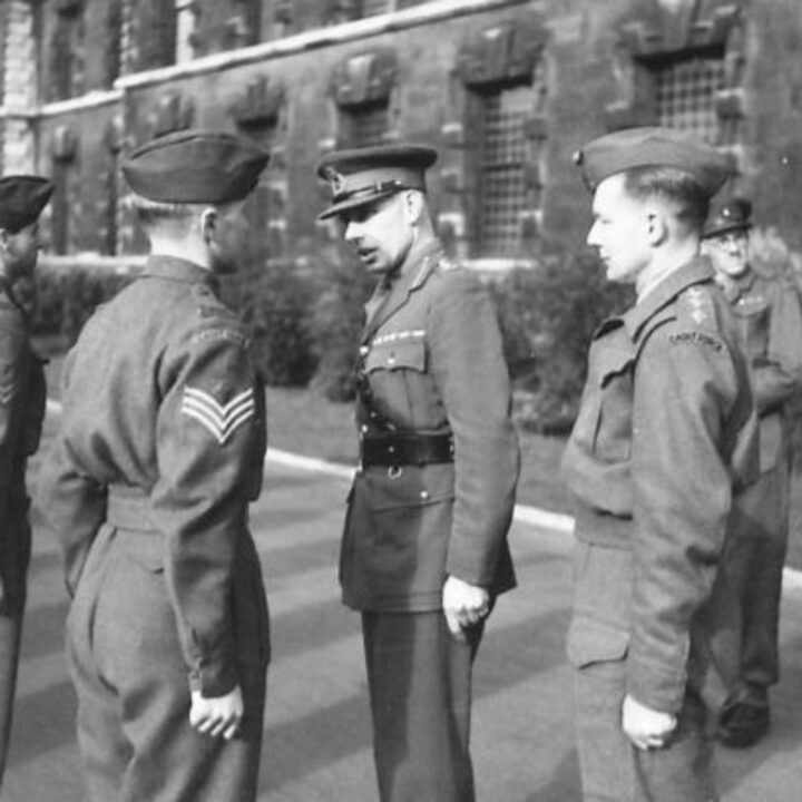 Major General Lord Bridgeman D.S.O., M.C. (Director General of the Home Guard) talking to a Sergeant during an inspection of a Cadet Battalion of the Royal Ulster Rifles at the Royal Belfast Academical Institution.