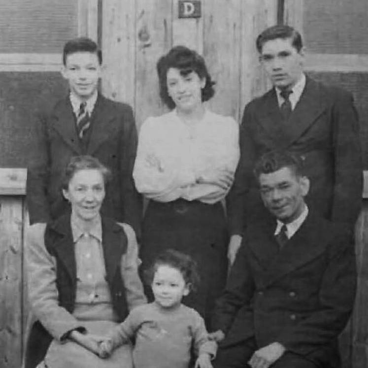 Evacuees from Gibraltar the Martinez family (Pepe, Amanda, Johnny, Menchi, Clive, and John) outside the dining room at Camp no. 2 Cargagh near Downpatrick, Co. Down.