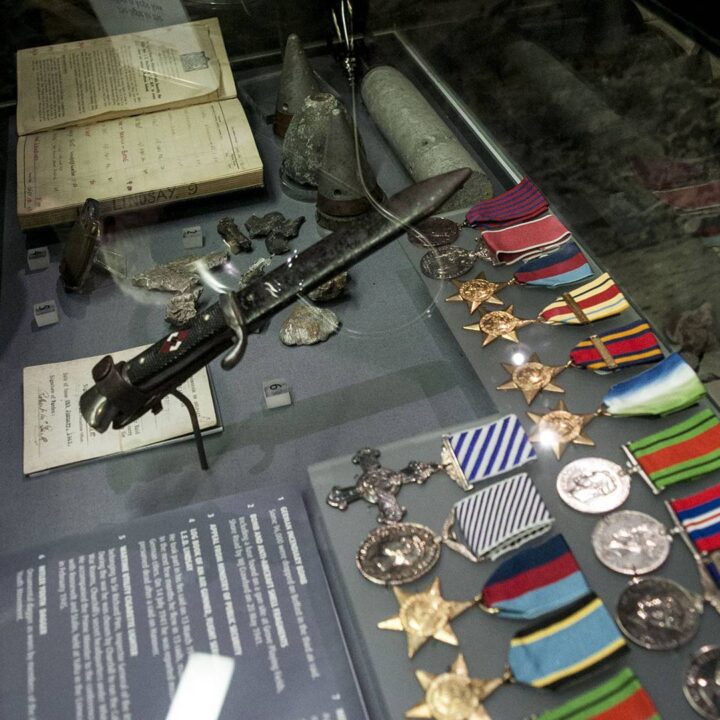 Artefacts including artwork, uniforms, and heritage items on display at the Northern Ireland War Memorial's Belfast Blitz 75 event as part of Culture Night Belfast 2016.