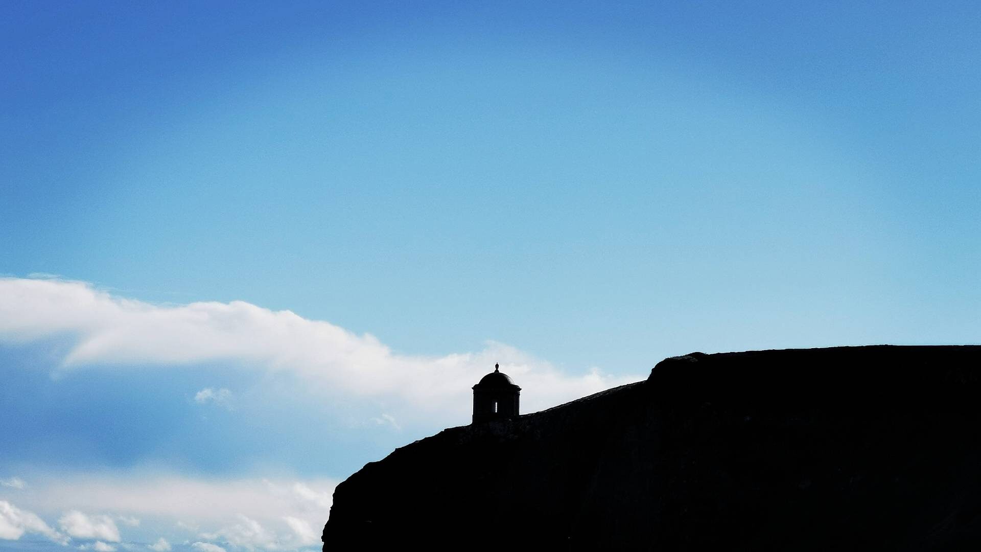 The silhouette of Mussenden Temple - a National Trust Northern Ireland property - overlooking the beach at Downhill. Co. Londonderry.