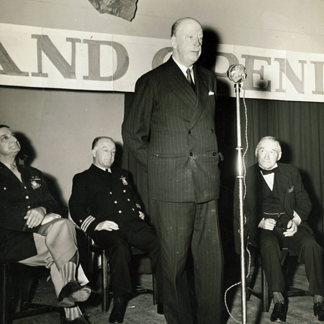 Major General Russell P. Hartle of the United States Army looks on as the Duke of Abercorn (Governor of Northern Ireland) addresses a crowd.