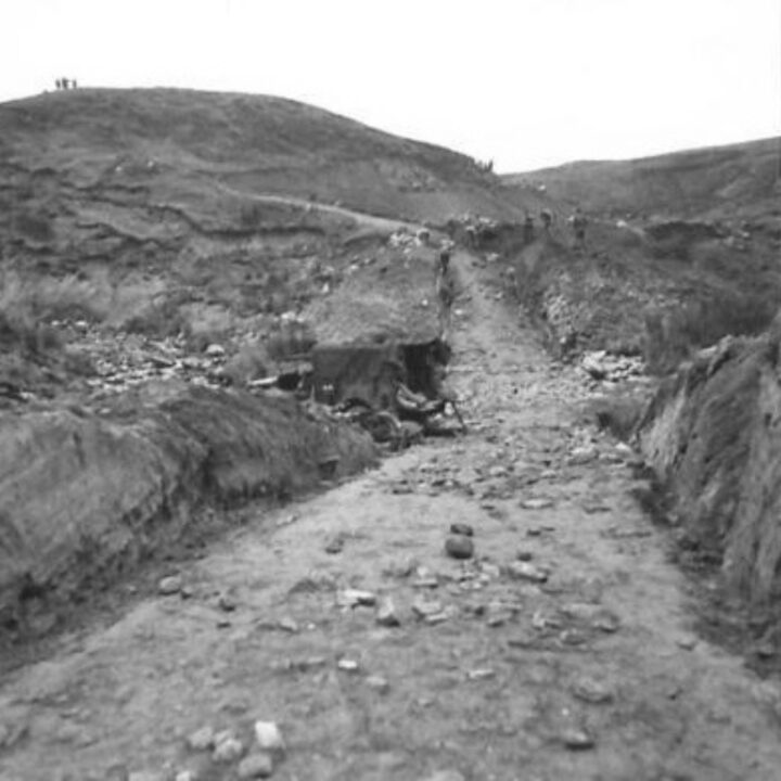 Members of the 61st Divisional Engineers cutting a new road through the Sperrin Mountains at Templemoyle, south of Dungiven, Co. Londonderry. The first cut of the new road.