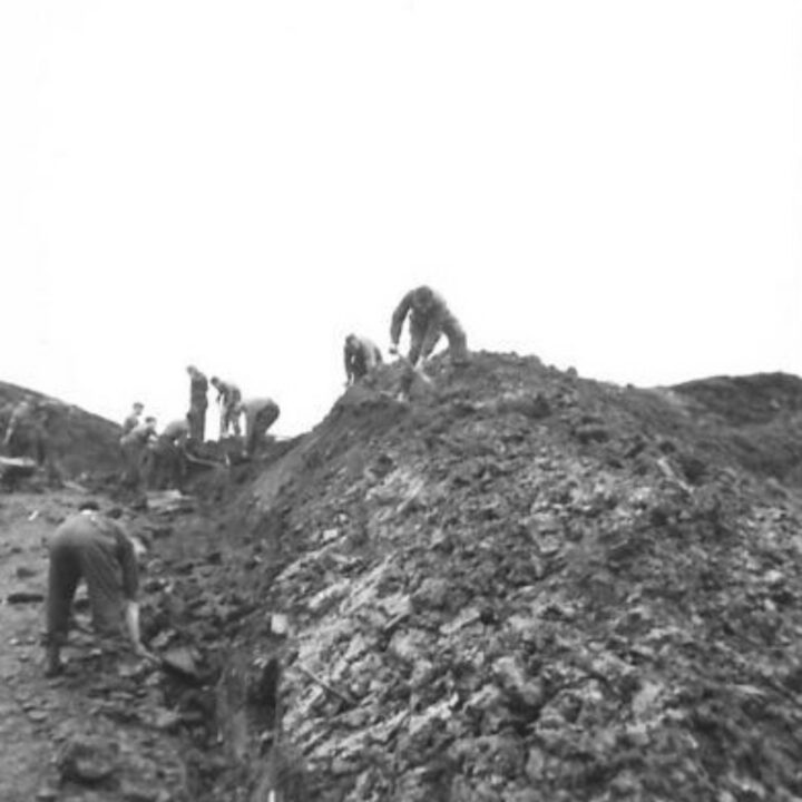 Members of the 61st Divisional Engineers cutting a new road through the Sperrin Mountains at Templemoyle, south of Dungiven, Co. Londonderry. Sappers at work on the bluff.