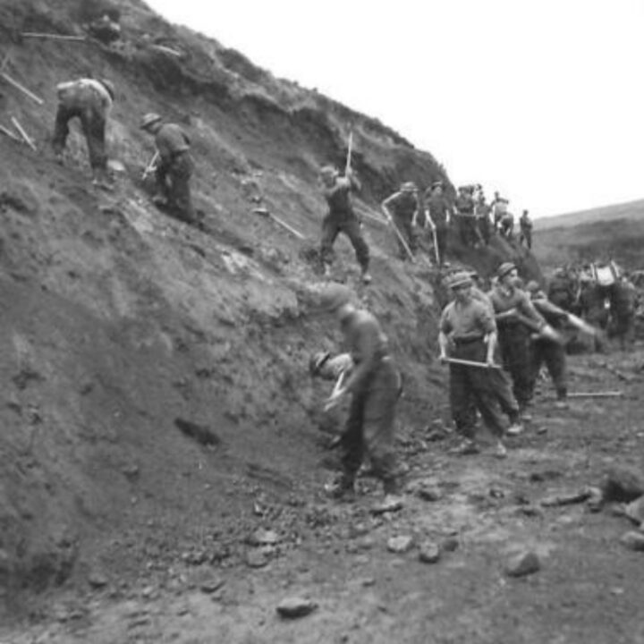 Members of the 61st Divisional Engineers cutting a new road through the Sperrin Mountains at Templemoyle, south of Dungiven, Co. Londonderry. Sappers at work on the bluff.