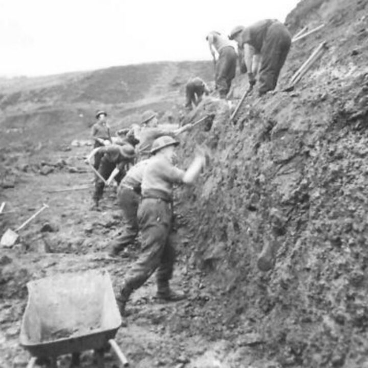 Members of the 61st Divisional Engineers cutting a new road through the Sperrin Mountains at Templemoyle, south of Dungiven, Co. Londonderry. Sappers at work on the mountainside.