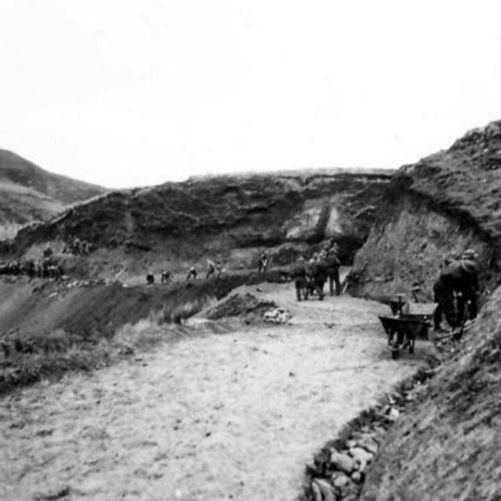 Members of the 61st Divisional Engineers cutting a new road through the Sperrin Mountains at Templemoyle, south of Dungiven, Co. Londonderry. A general view of the winding road.