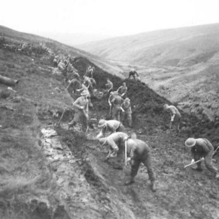 Members of the 61st Divisional Engineers cutting a new road through the Sperrin Mountains at Templemoyle, south of Dungiven, Co. Londonderry. Sappers at work cutting through bush bog.
