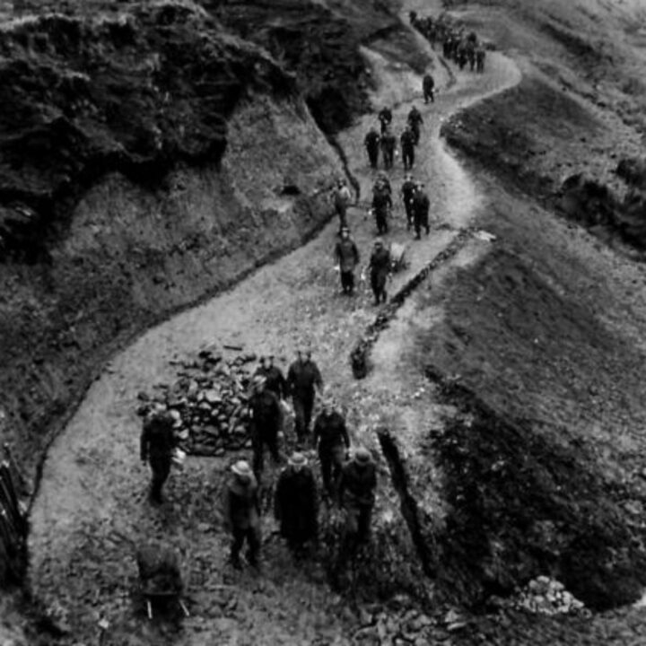Members of 297, 582, 583, and 584 Companies, Kent Corps Troops, Royal Engineers cutting a new road through the Sperrin Mountains and Templemoyle, south of Dungiven, Co. Londonderry. A completed section of the new road.