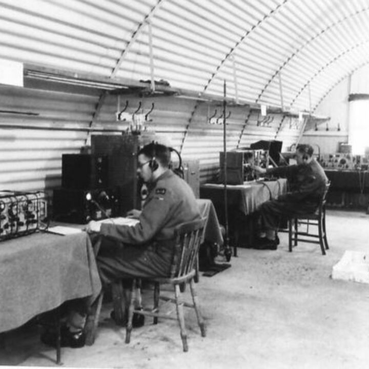 Radio operators at work with transmitter and receiver sets. This picture is part of a series taken at a Signal Corps Exhibition in Lisburn, Co. Antrim.