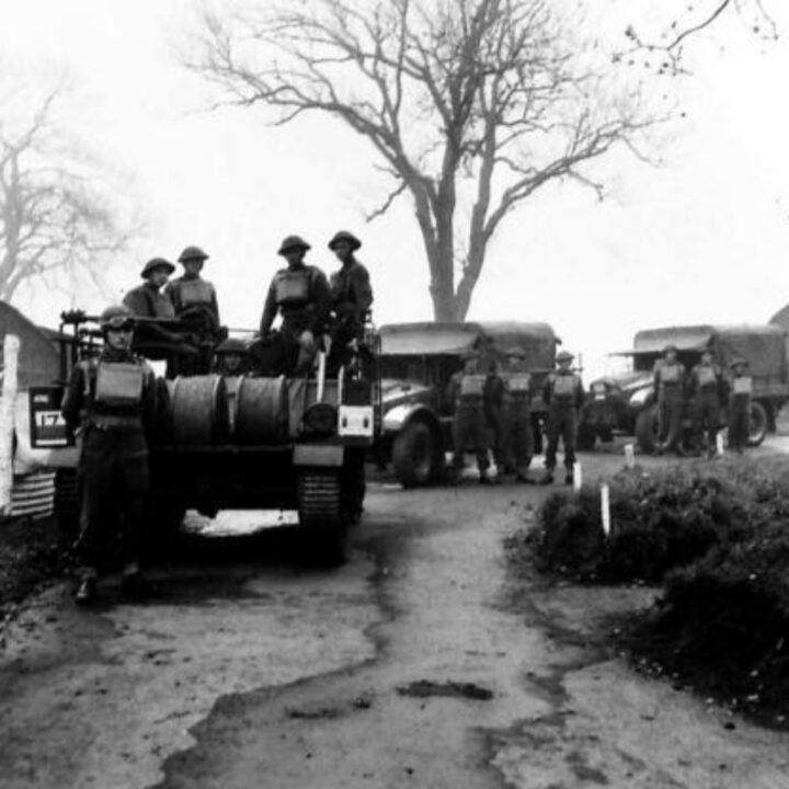 Crew in position on a vehicle fitted out to begin laying of D8 field telephone cable. This picture is part of a series taken at a Signal Corps Exhibition in Lisburn, Co. Antrim.