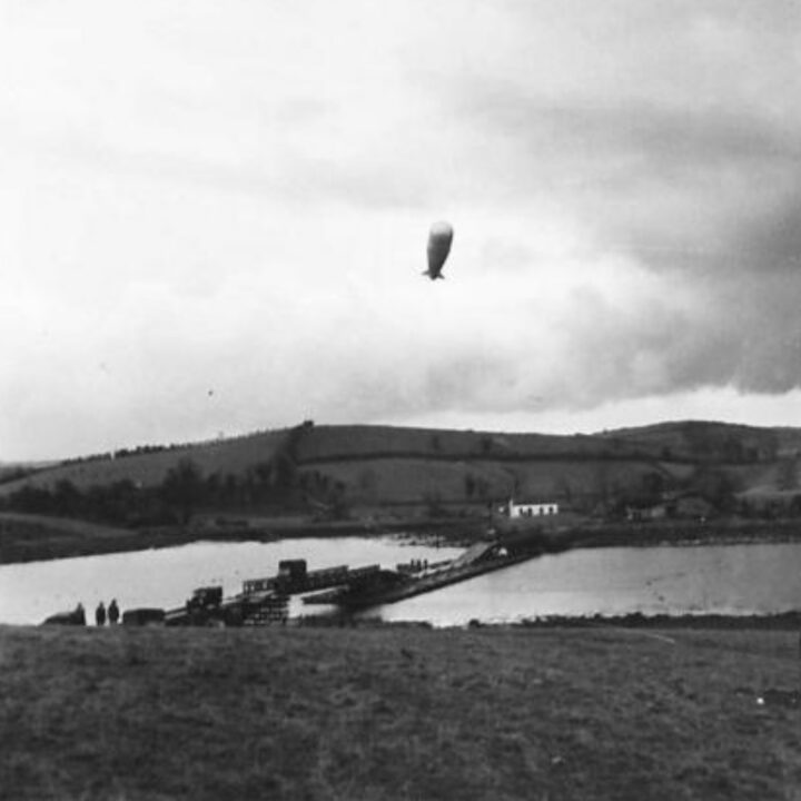 A barrage balloon gets airborne as a smokescreen is laid during a training exercise at the bridge on the River Quoile near Downpatrick, Co. Down.