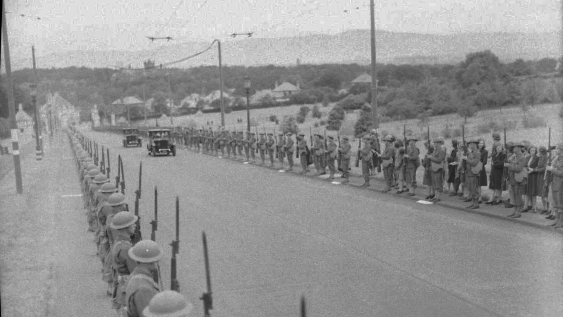 Members of the United States Army wearing British-style Brodie helmets form a guard of honour along the route to Parliament Buildings in the Stormont Estate, Belfast.