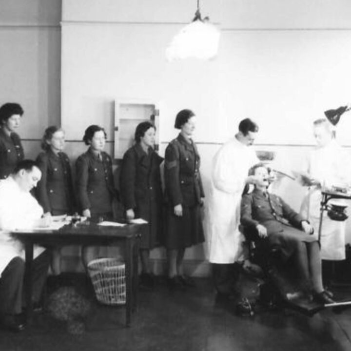 Members of the A.T.S. line up for a routine inspection with a dental surgeon observer at an Army Dental Centre at 389-391 Antrim Road, Belfast. Such centres provide a service to the British Army and the Auxiliary Territorial Service that usually only the wealthy could afford.