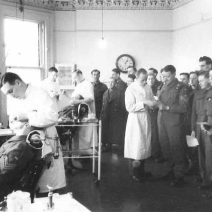 British Army soldiers line up for a routine inspection with a dental surgeon observer at an Army Dental Centre at 389-391 Antrim Road, Belfast. Such centres provide a service to the British Army and the Auxiliary Territorial Service that usually only the wealthy could afford.
