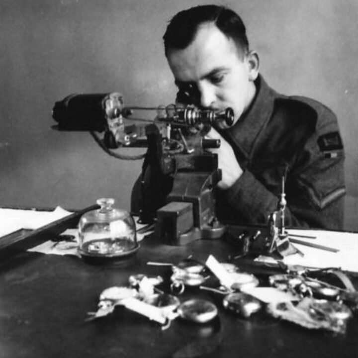 Lance Corporal Isherwood of Bolton, Lancashire, England, a trained watchmaker at work at a Royal Electrical and Mechanical Engineers base workshop at Kinnegar Barracks, Holywood, Co. Down.