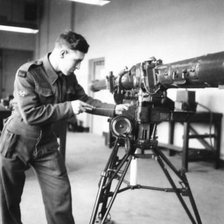 Craftsman Snell of Chester, England testing an anti-aircraft rangefinder in need of repair at a Royal Electrical and Mechanical Engineers base workshop at Kinnegar Barracks, Holywood, Co. Down.