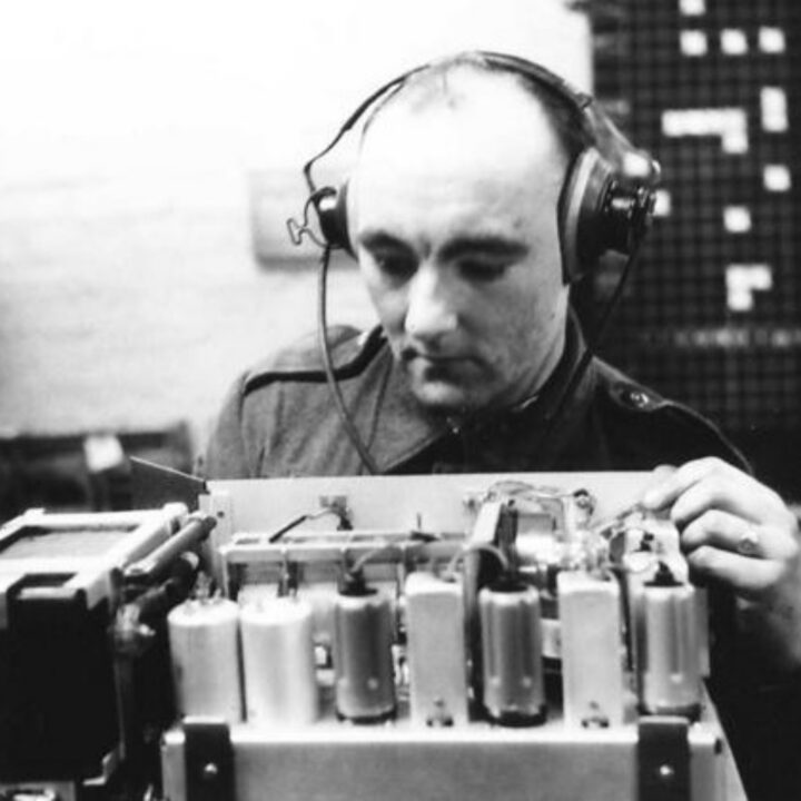 Craftsman Sykes of Bradford, Yorkshire, England at work on delicate wireless radio equipment at a Royal Electrical and Mechanical Engineers base workshop at Kinnegar Barracks, Holywood, Co. Down.
